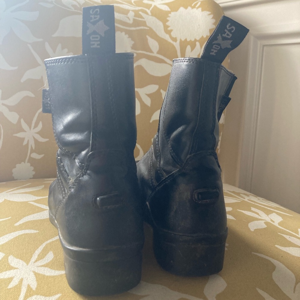 Girls Saxon (size 4) riding boots. Good condition, but some cracking on toe